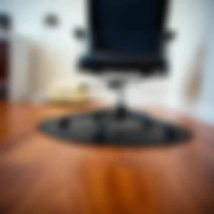 Close-up of a chair gliding over a protected hardwood floor