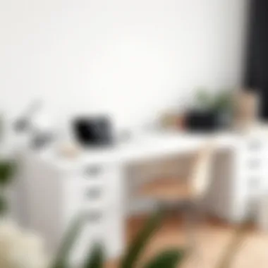 Minimalist white L-shaped desk featuring a laptop and stationery