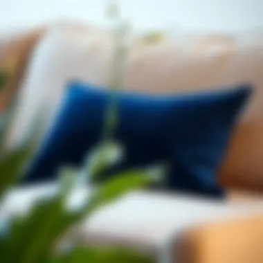 Luxurious dark blue velvet sofa pillow on a modern couch