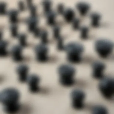 Variety of matte black knobs A variety of matte black knobs displayed on a textured surface