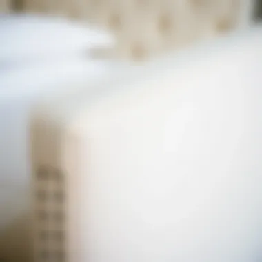 Close-up of ivory fabric texture on a bed frame
