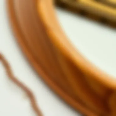 Close-up of intricate wood grain on an oblong mirror frame highlighting craftsmanship