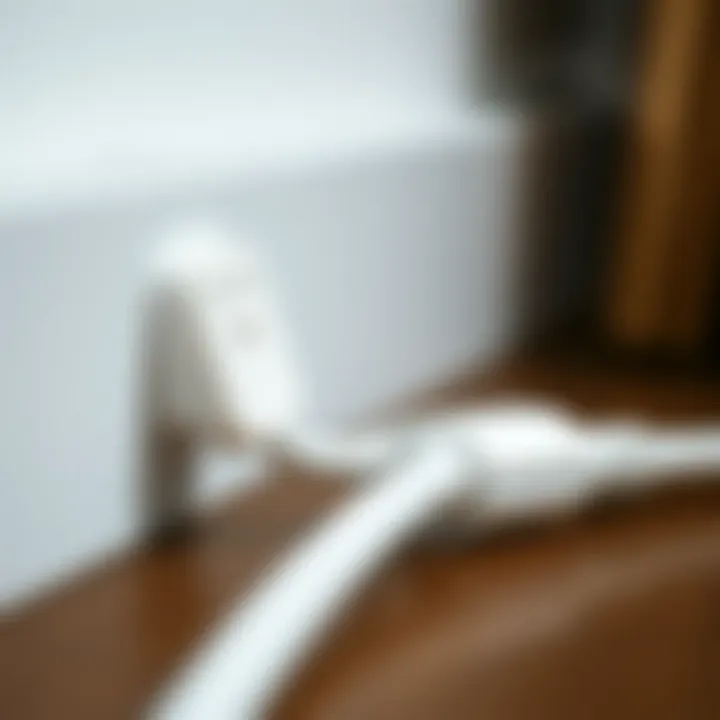 Close-up view of a slim white extension cord demonstrating its safety features and design.