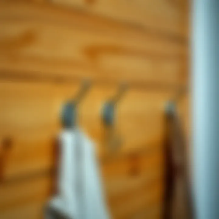 Installing Metal Coat Hooks Installation of metal coat hooks on a wooden wall