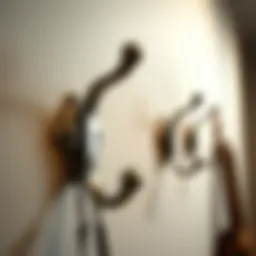 Stylish metal coat hooks mounted on a wall