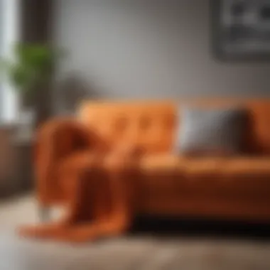 Stylish orange sofa throw draped over a modern couch