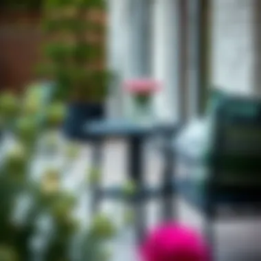 Black Metal End Table with Outdoor Chairs Black metal end table paired with stylish outdoor chairs