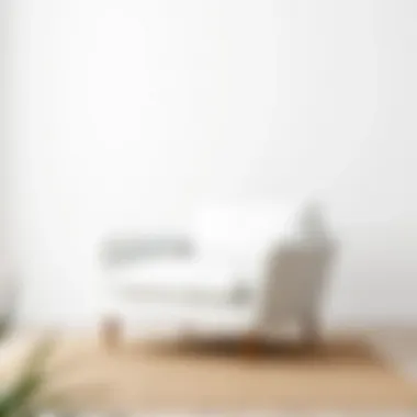 Minimalist white sofa chair against a neutral backdrop